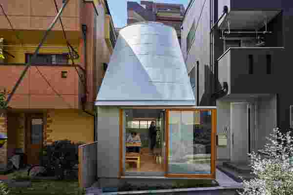 This tiny house in Tokyo boasts of a funnel-shaped roof that doubles as a skylight!
