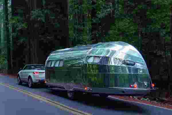 This futuristic luxury camper comes with HEPA filters + pet bed for a unique glamping experience!