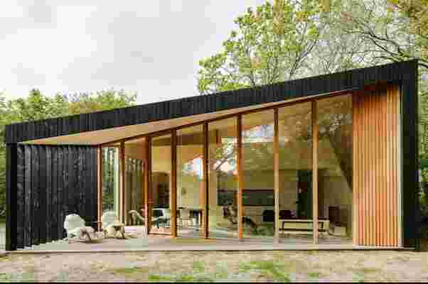 This prefab holiday home in Netherlands has transforming rooms that go from day to night instantly!
