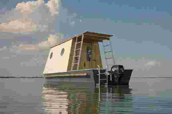 This houseboat was designed to blend in the natural landscape & encourage sustainable travel